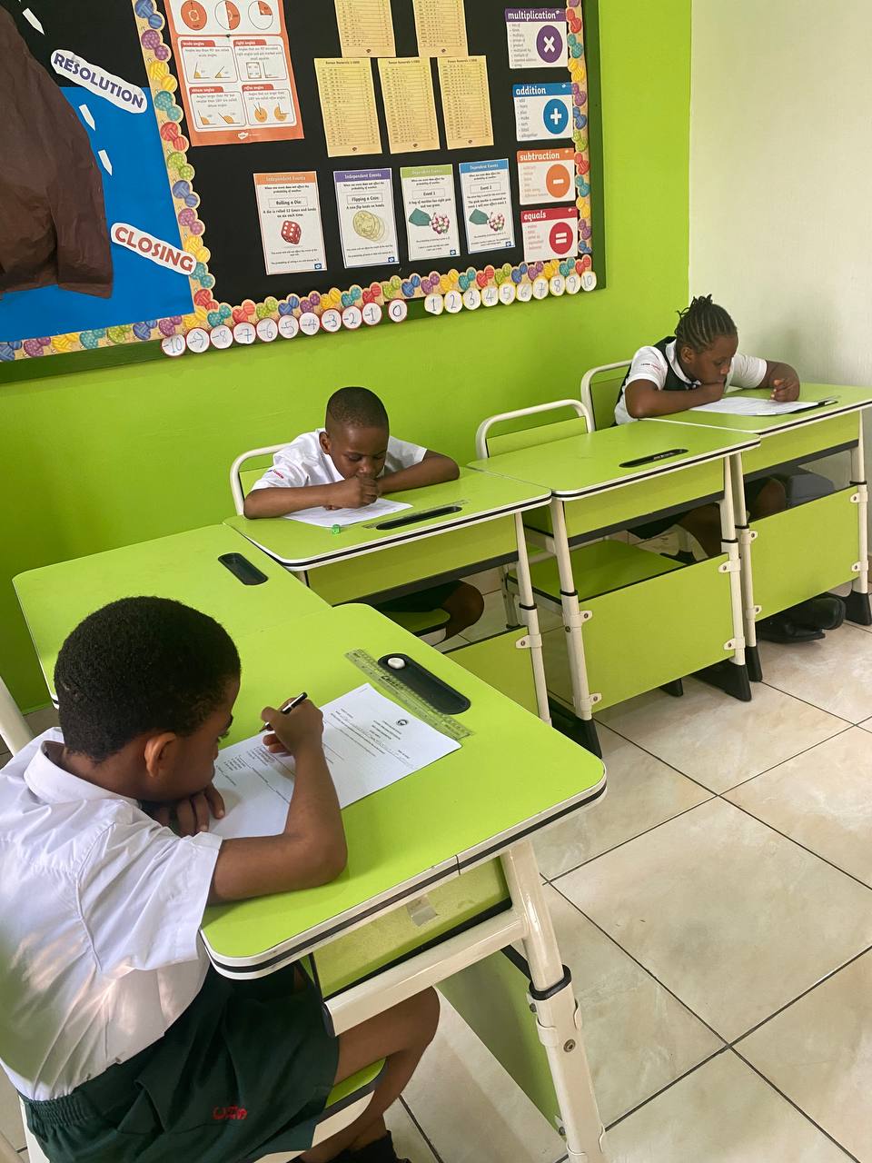 Students writing in modern classroom